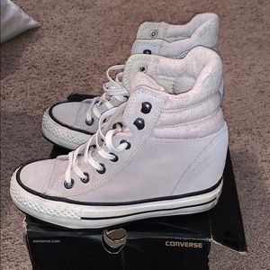 Converse wedges in the color sand.